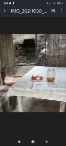 a table with a plate of food and a drink on it at hostel Mrganush in Meghri