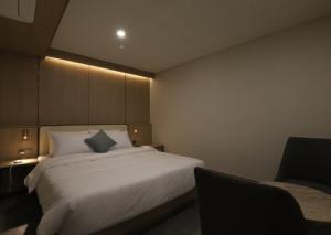 Llit o llits en una habitació de H Avenue Hwamyeong