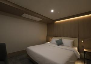 Llit o llits en una habitació de H Avenue Hwamyeong