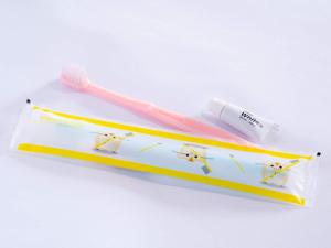 a toothbrush and toothpaste in a package on a white background at APA Hotel Nagasaki Dejima in Nagasaki