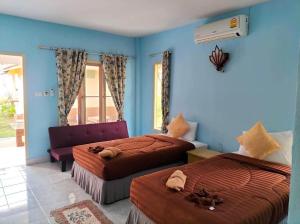 Postel nebo postele na pokoji v ubytování Salatan Resort