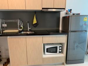 Kuchyň nebo kuchyňský kout v ubytování Laguna beach condo resort 3 maldives pattaya pool view ลากูน่า บีช คอนโด รีสอร์ต 3 พัทยา
