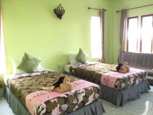 Postel nebo postele na pokoji v ubytování Salatan Resort