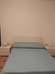 Кровать или кровати в номере Casa di Andy