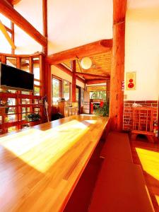 a dance floor in a room with wooden floors at Hakuba Brownie Cottages in Hakuba