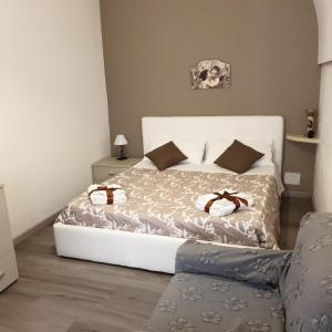 A bed or beds in a room at Casa del Duomo Modica