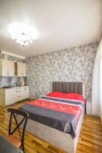 Llit o llits en una habitació de Мини - ГОСТИНИЦА "ЛЮБИМЫЙ ДОМ" 33 fotos més