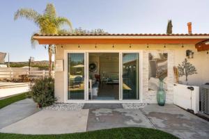 a house with a large sliding glass door at MAGIC VILLA Overlooking Pool Oasis in Temecula