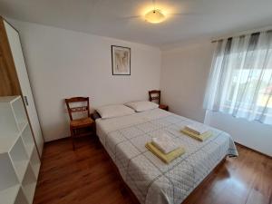 Postel nebo postele na pokoji v ubytování Baška Portside