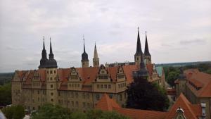 a large castle with turrets and spires on top at Pension Am Rosental Merseburg in Merseburg