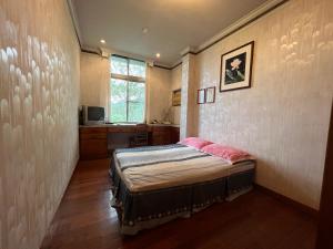 Postel nebo postele na pokoji v ubytování Ri Jing Yuan Homestay