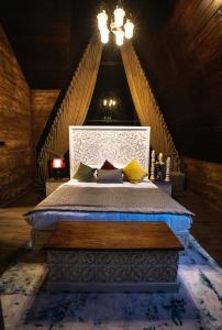 a bedroom with a large bed in an attic at The Edgware Cabana in Nuwara Eliya