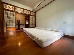 Postel nebo postele na pokoji v ubytování Ri Jing Yuan Homestay