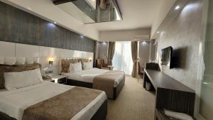 TV a/nebo společenská místnost v ubytování MOX Hotel Wellness & Spa