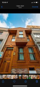 a picture of a wooden building with windows at Double Q Apart in Istanbul