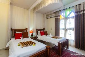 Rúm í herbergi á Al-Minar Hotel