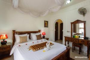 Rúm í herbergi á Al-Minar Hotel