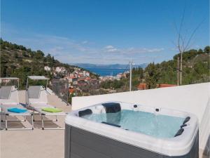 a hot tub on the roof of a house at Villa Anđelina in Stomorska