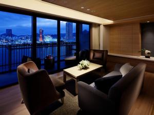 a living room with a view of a city at Kobe Minato Onsen Ren in Kobe