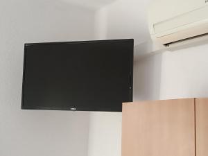 a flat screen tv hanging on a wall at Motel Gas-Petrol Samac in Bosanski Šamac