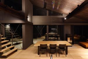a dining room with a table and chairs at Hakuba Aurora Chalet by Jade Villa in Hakuba +209 photos