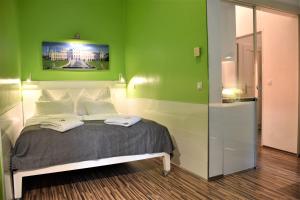 Ein Bett oder Betten in einem Zimmer der Unterkunft Studio-Apartment Augarten
