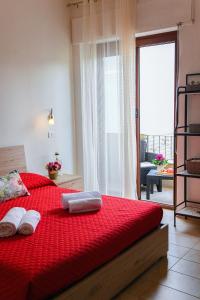 Letto o letti in una camera di B&B I Gerani
