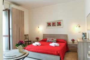 Letto o letti in una camera di B&B I Gerani