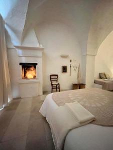 Llit o llits en una habitació de I Tre Coni by Acqua di Puglia