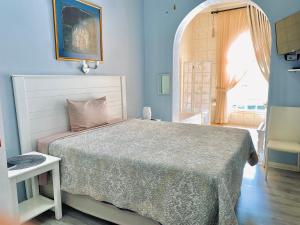 a bedroom with a bed and a large window at Barberton BnB in Barberton