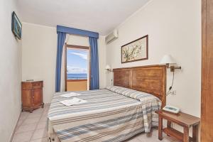 A bed or beds in a room at Hotel Villa Rodriguez