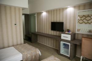 Postel nebo postele na pokoji v ubytování MOX Hotel Wellness & Spa