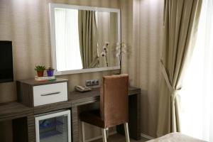 TV a/nebo společenská místnost v ubytování MOX Hotel Wellness & Spa