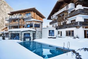Bazén v ubytování HUBER's Boutiquehotel nebo v jeho okolí