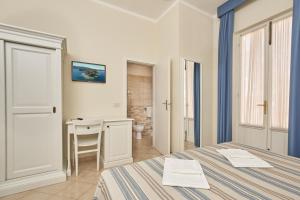 A bed or beds in a room at Hotel Villa Rodriguez