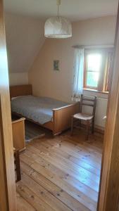 Ένα ή περισσότερα κρεβάτια σε δωμάτιο στο Gut Hanerau, Erlenufer keine Monteure