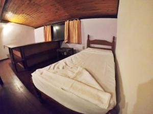 Postel nebo postele na pokoji v ubytování Eco-Flats Cachoeira Azul