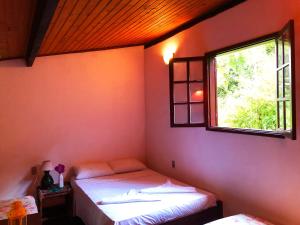 Postel nebo postele na pokoji v ubytování Eco-Flats Cachoeira Azul