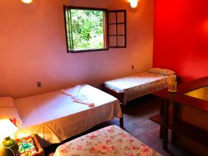 Postel nebo postele na pokoji v ubytování Eco-Flats Cachoeira Azul