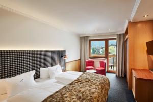 Postel nebo postele na pokoji v ubytování HUBER's Boutiquehotel