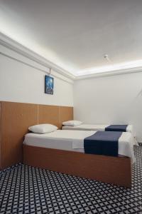 a bedroom with a large bed in a room at Deniz Pansiyon in İzmir