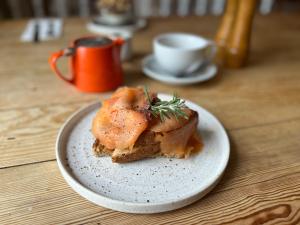 a piece of food on a plate on a table at The Black Fox in Bath