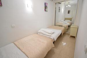 A bed or beds in a room at BENAL BEACH, Superb 2 Bedroom 2 Bathroom Beach front Apartment sleeps 6
