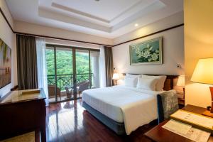 Ein Bett oder Betten in einem Zimmer der Unterkunft Vinpearl Resort Nha Trang