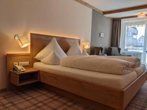 Postel nebo postele na pokoji v ubytování Hotel Germania