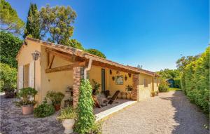 an exterior view of a house with a patio at Awesome Home In Mougins With 2 Bedrooms, Wifi And Outdoor Swimming Pool in Mougins