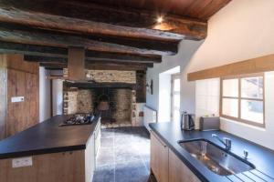 a kitchen with a sink and a counter top at Domaine des Grands Bois Privatisé in Sergeac