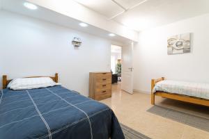 a bedroom with a bed and a dresser in it at Rr Villa in Monforte del Cid +24 photos