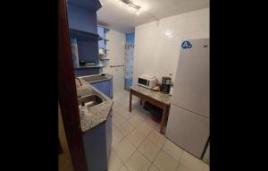 a small kitchen with a sink and a refrigerator at BE LIKE AT HOME PARIS in Alcalá de Henares