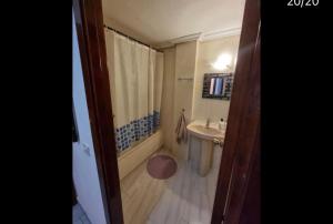 a bathroom with a tub and a sink and a shower at BE LIKE AT HOME PARIS in Alcalá de Henares
